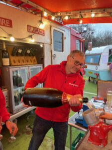 Serving Champagne from a Methuselah bottle to guests